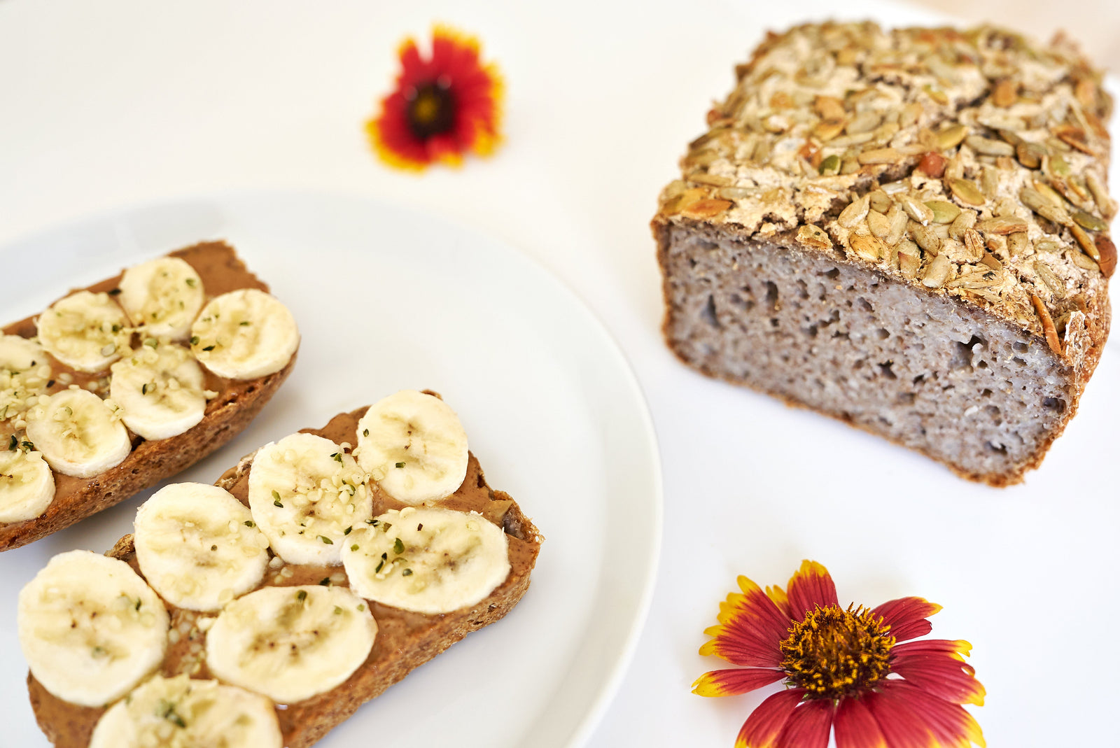 Sliced buckwheat bread loaf with banana and peanut butter toppings