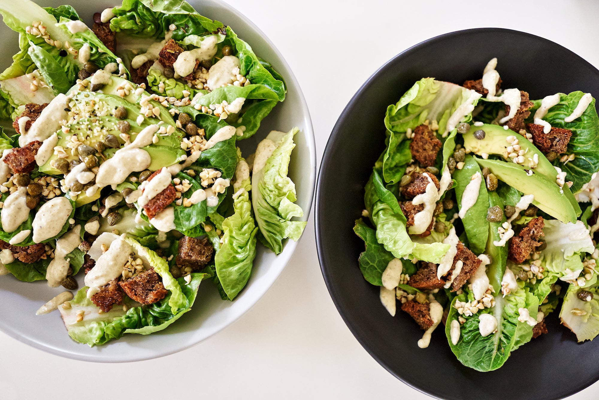 Vegan gluten-free caesar salad with buckwheat groats in two bowls